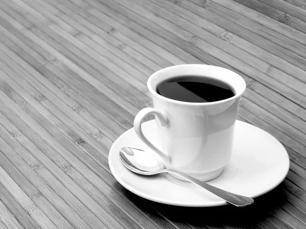 Cup of coffee on wooden background — Stock Photo, Image