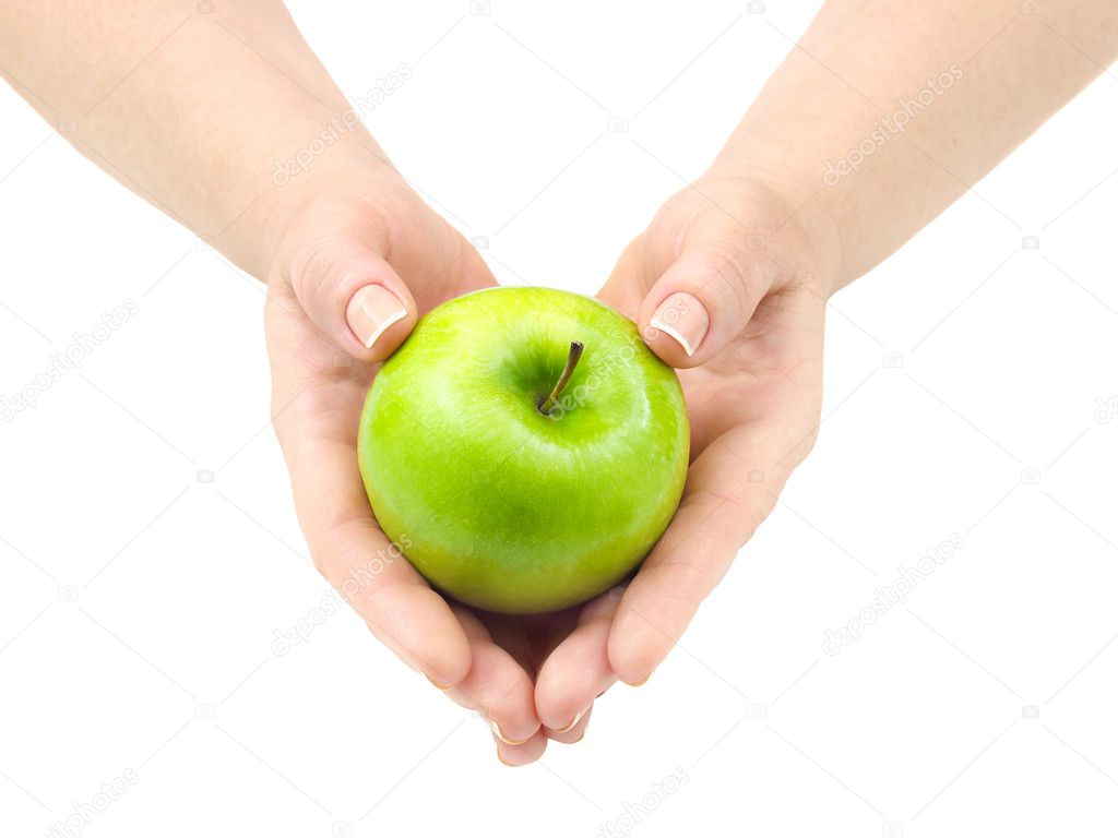 Green apple in hands.