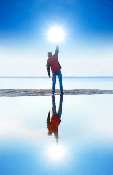 Persons and reflection in water. — Stock Photo, Image