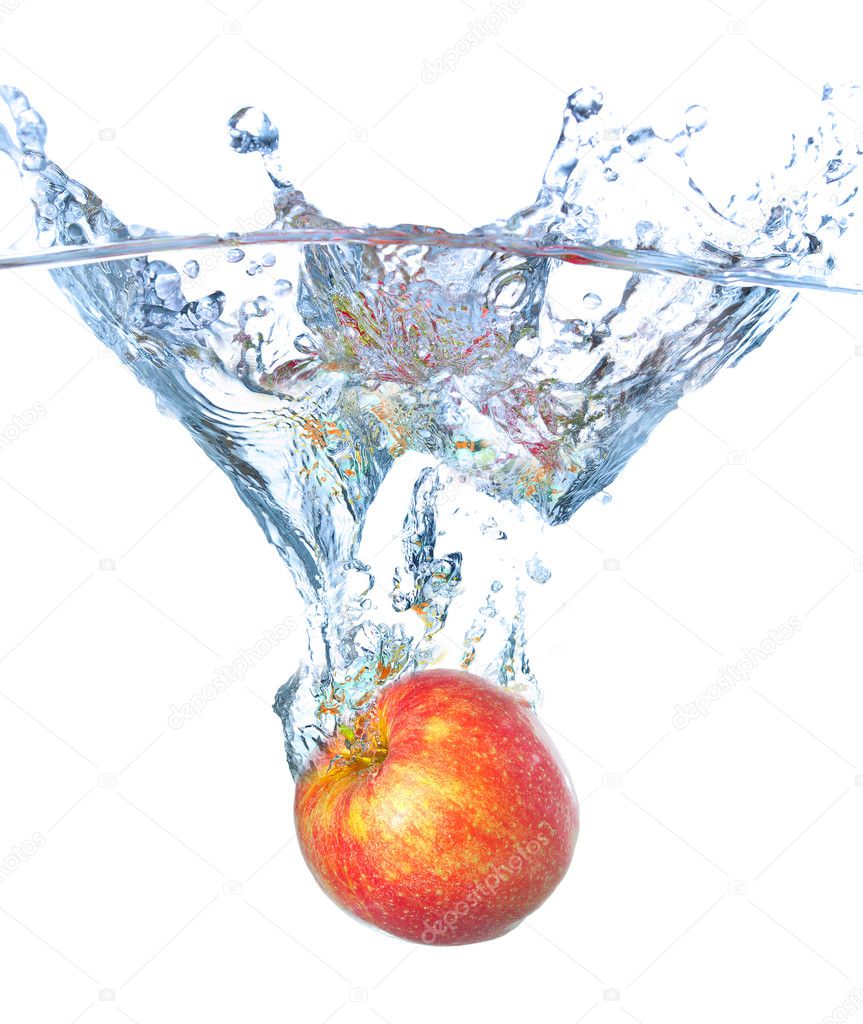 Bright red apple and water splash