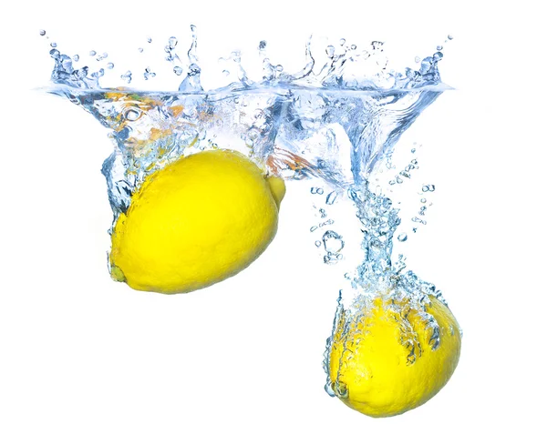 Bright yellow lemons in water — Stock Photo, Image