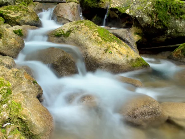 Fast creek and waterfall among stones — Stock Photo, Image