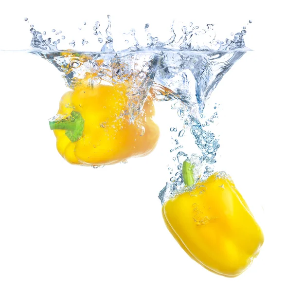 Bright yellow peppers under water — Stock Photo, Image