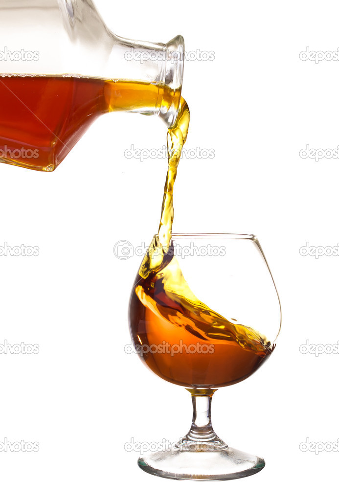 Bottle with glass of brandy