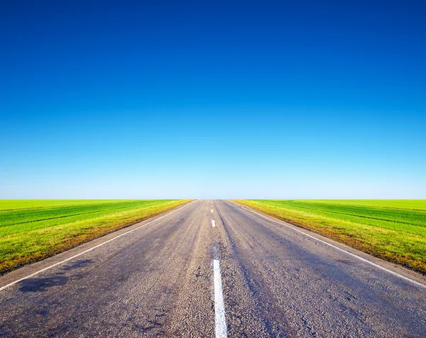 Road and bright sky — Stock Photo, Image