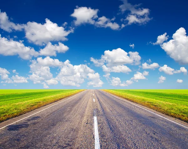 Road and bright sky Stock Image