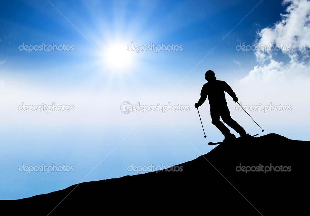 Silhouette of a skier on the hill.