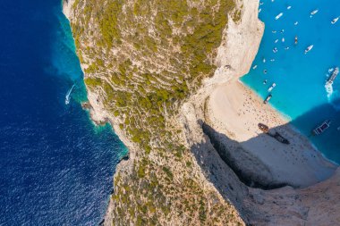 View of Navagio beach, Zakynthos Island, Greece. Vacation time. Aerial landscape from drone. Blue sea water. Rocks and sea. Summer landscape from the air.