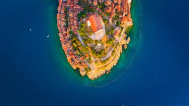 Rovinj, Croatia. Aerial view. Old historic buildings in the bay. Harbor with boats. Beautiful romantic old town of Rovinj during sunset, Istrian peninsula, Croatia, Europe. 