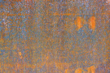 Arka plan olarak metalin üzerindeki pas. Metal parçalarında aşınma. Tasarım için soyut kompozisyon. Parlak kırmızı pas.