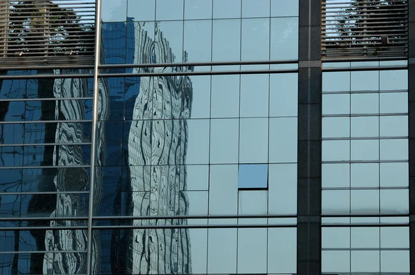 Skyscrapers in reflection — Stock Photo, Image