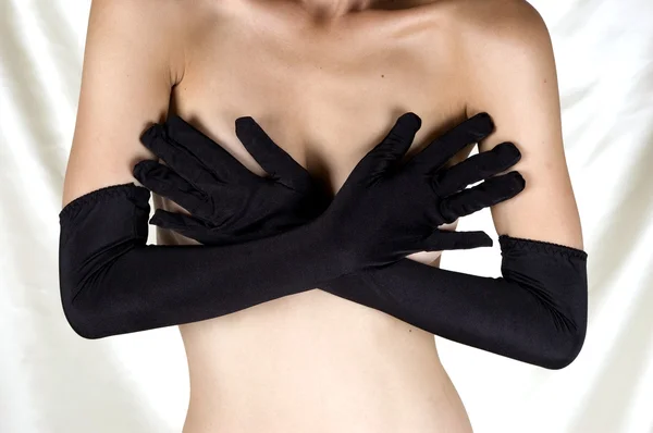 Seins couverts de mains en gants sexy — Photo