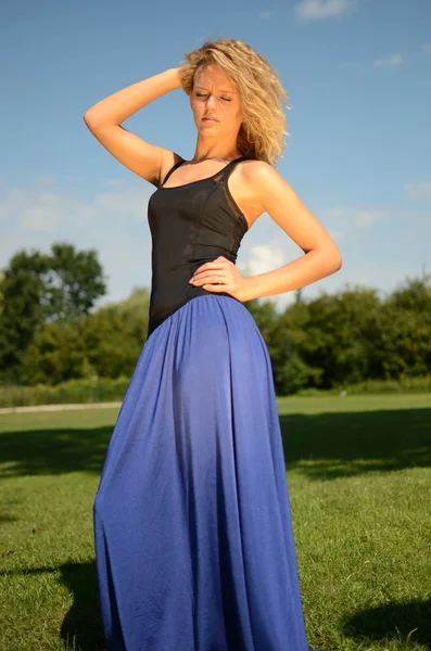 Blond female model in blue dress — Stock Photo, Image