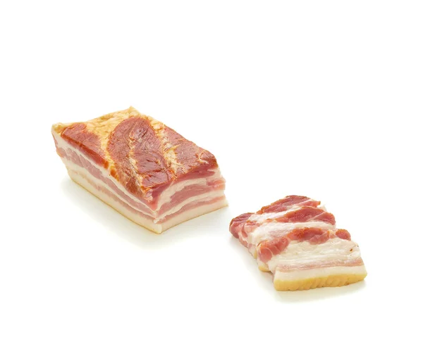 Big Bacon Part and Slices in Front Left — Stock Photo, Image