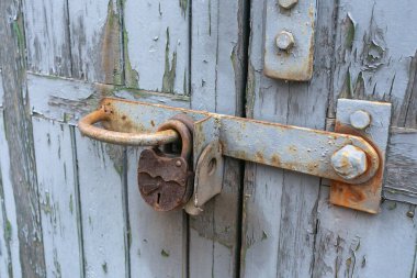 Old wooden boards with cracked paint and handles