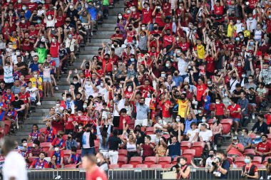 KALLANG, SINGAPORE - 15TH JULY, 2022: Human wave from Unidentified fan of Liverpool during pre-season against Crystal Palace at national stadium