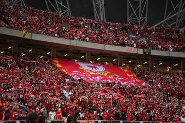 KALLANG, SINGAPORE - 15TH JULY, 2022: Unidentified fans of Liverpool in action during pre-season against Crystal Palace at national stadium