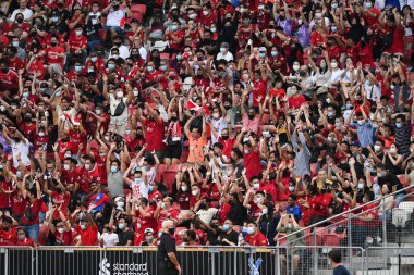 KALLANG, SINGAPORE - 15TH JULY, 2022: Human wave from Unidentified fan of Liverpool during pre-season against Crystal Palace at national stadium
