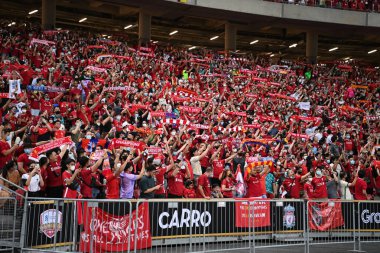 KALLANG, SINGAPORE - 15TH JULY, 2022: Unidentified fans of Liverpool in action during pre-season against Crystal Palace at national stadium