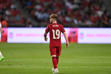 KALLANG, SINGAPORE - 15TH JULY, 2022: Harvey Elliott #19 Player of Liverpool in action during pre-season against Crystal Palace at national stadium clipart
