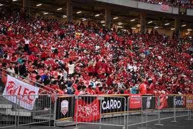 KALLANG, SINGAPORE - 15TH JULY, 2022: Unidentified fans of Liverpool in action during pre-season against Crystal Palace at national stadium