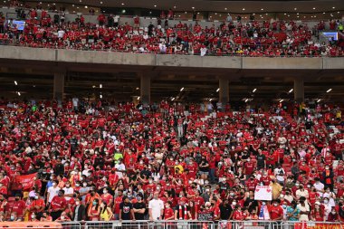 KALLANG, SINGAPORE - 15TH JULY, 2022: Unidentified fan of liverpool in action during pre-season against crystal palace at national stadium. 