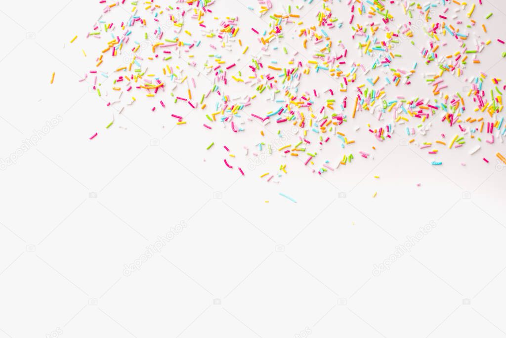 Sprinkles on a white background. Colored background. 