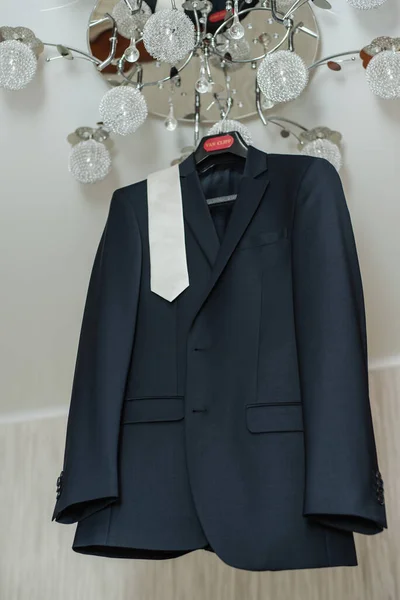 Men's jacket on a hanger.