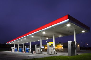 Empty gas station at night clipart