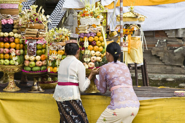 Preparing offerings for a temple ceremony in Bali
