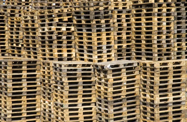 Stacked pile of of wooden Euro pallets — Stock Photo, Image