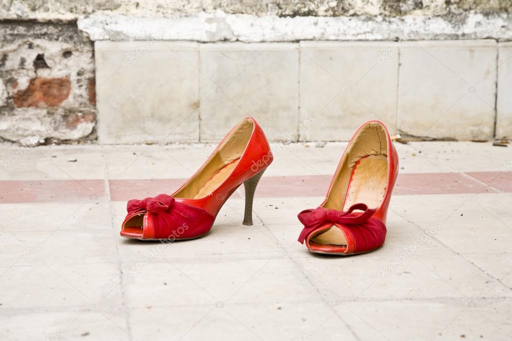 Red high heel shoes in a slum area in Jakarta
