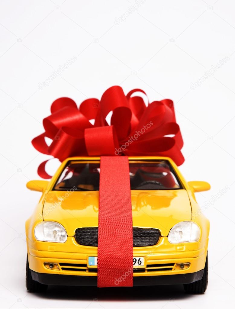 Luxury present wrapped in red ribbon