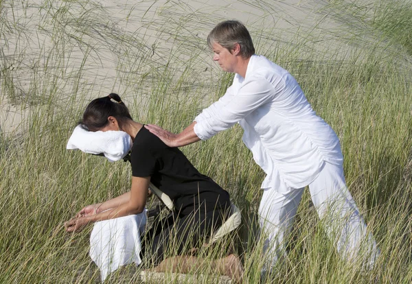 Chair massage in the dunes on the island Ameland, the Netherlands — Stock Photo, Image