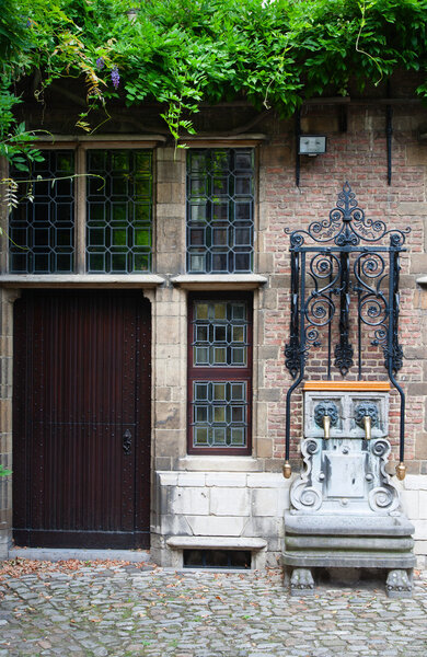 Water pump at the courtyard of the Rubenshouse, the former home and studio of Peter Paul Rubens in Antwerp, Belgiu