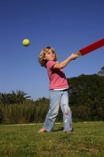 Girl playing rounders