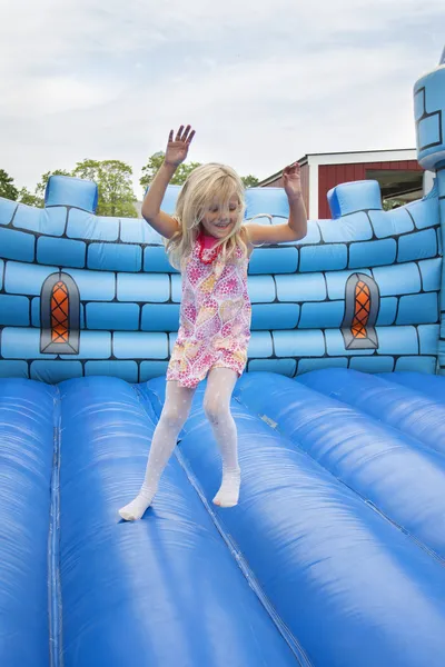 Child in bouncing castle — Stock Photo, Image