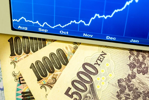 Yen japonês e gráfico — Fotografia de Stock
