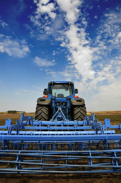 The Tractor - modern farm equipment in field — Stock Photo, Image