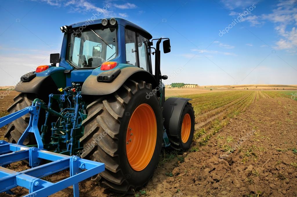 Huge tractor in the field In a nice blue sunny day ⬇ Stock Photo, Image by © DeshaCAM 28170071