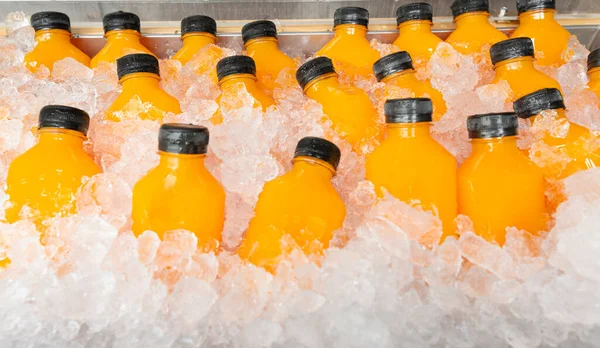food and drink, orange juice in a bottle with ice