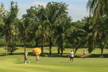 golfçüler ve golf sahası Tayland tarihinde taşıyıcılar