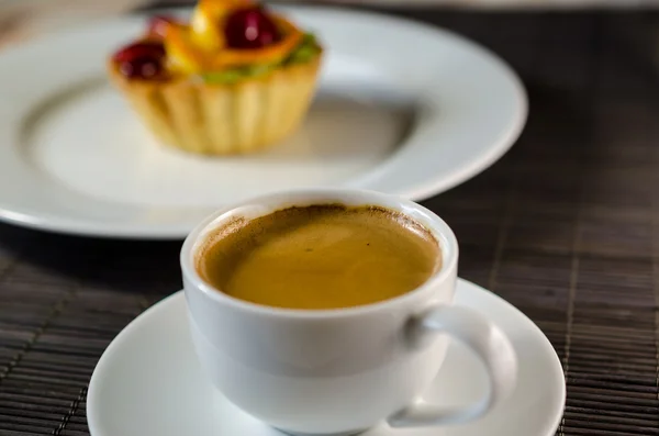 Filiżankę kawy i deser — Zdjęcie stockowe
