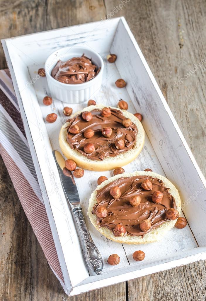 Bun slices with chocolate cream and nuts