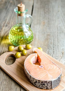 Food with unsaturated fats - salmon and olive oil clipart