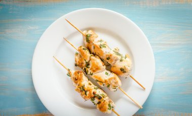 Grilled chicken skewers with herbs clipart