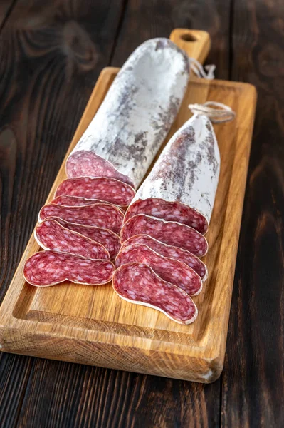 Sliced Fuet Catalan Cured Sausage Cutting Board — стокове фото