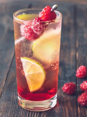 Glass of Raspberry lime rickey cocktail garnished with fresh berries