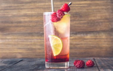 Glass of Raspberry lime rickey cocktail garnished with fresh berries