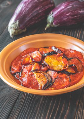 Fried slices of eggplant with tomato sauce